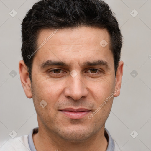 Joyful white adult male with short  brown hair and brown eyes