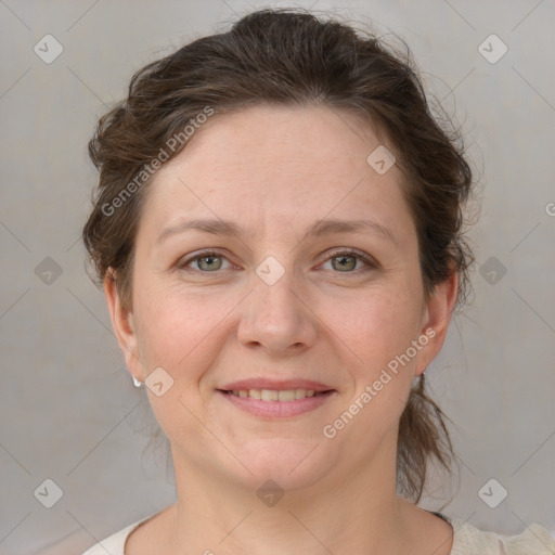 Joyful white adult female with medium  brown hair and grey eyes