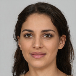 Joyful white young-adult female with medium  brown hair and brown eyes