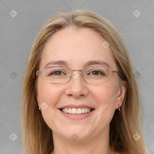 Joyful white adult female with medium  brown hair and grey eyes