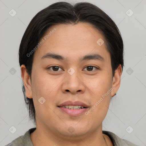 Joyful asian young-adult male with short  brown hair and brown eyes