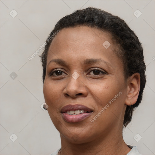 Joyful black young-adult female with short  brown hair and brown eyes