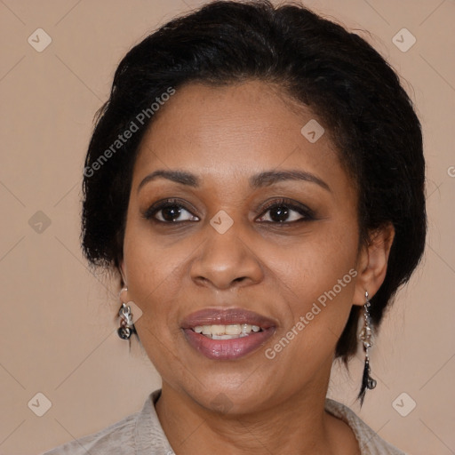 Joyful black adult female with medium  brown hair and brown eyes