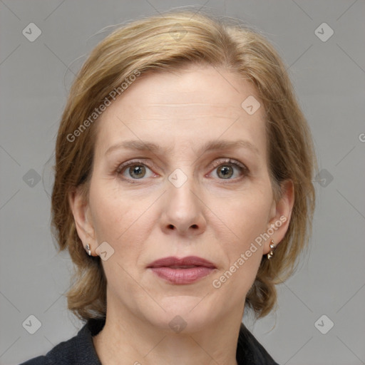 Joyful white adult female with medium  brown hair and grey eyes