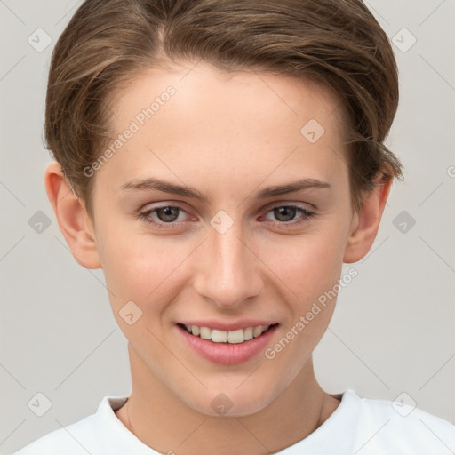 Joyful white young-adult female with short  brown hair and grey eyes