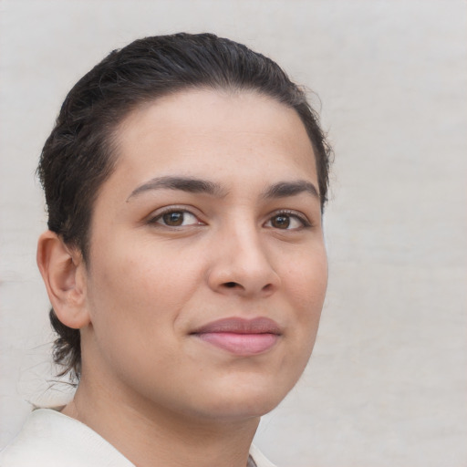 Joyful white young-adult female with short  brown hair and brown eyes