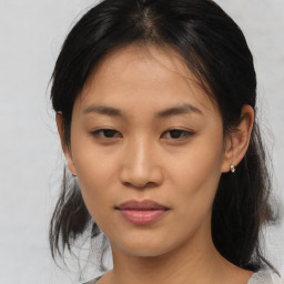 Joyful asian young-adult female with medium  brown hair and brown eyes