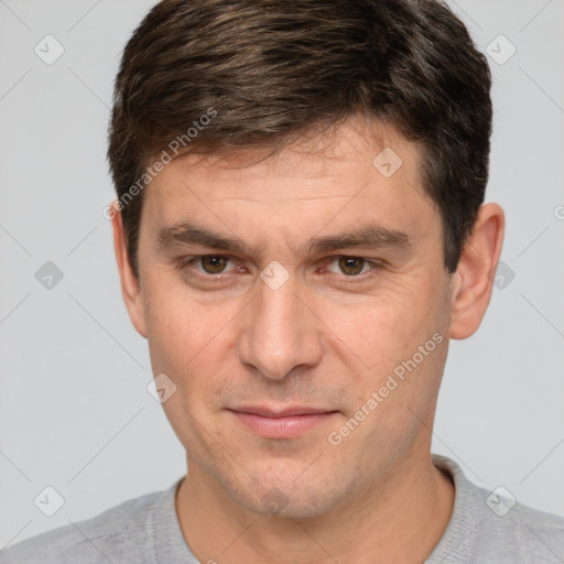 Joyful white adult male with short  brown hair and brown eyes