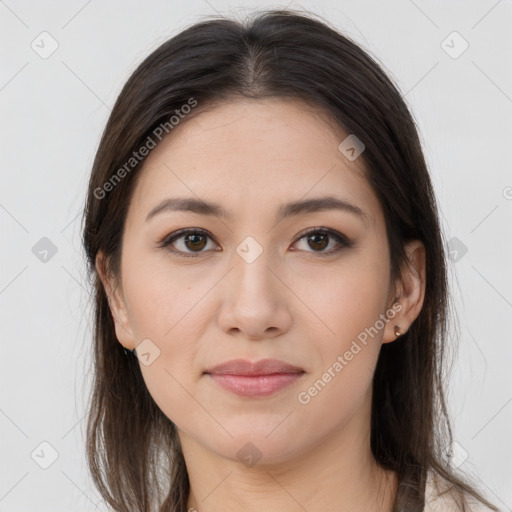 Joyful white young-adult female with long  brown hair and brown eyes