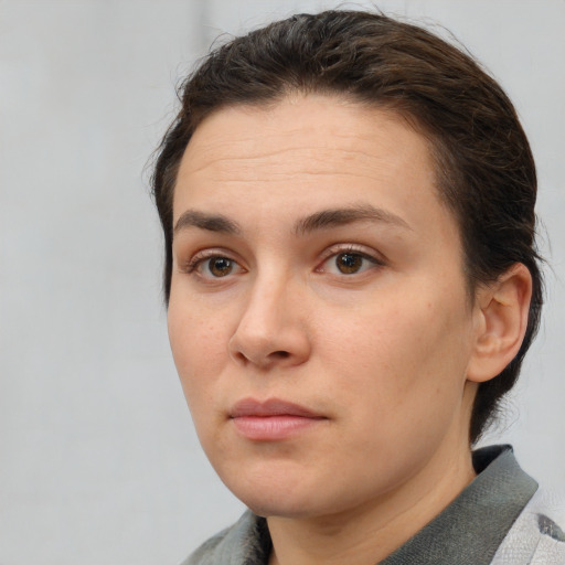 Neutral white young-adult female with short  brown hair and brown eyes