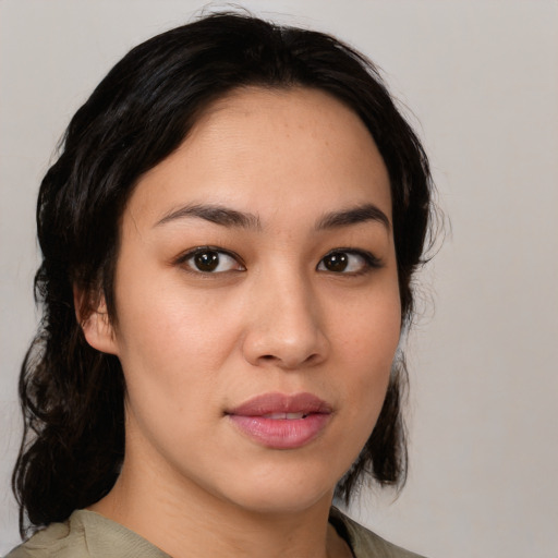 Joyful white young-adult female with medium  black hair and brown eyes