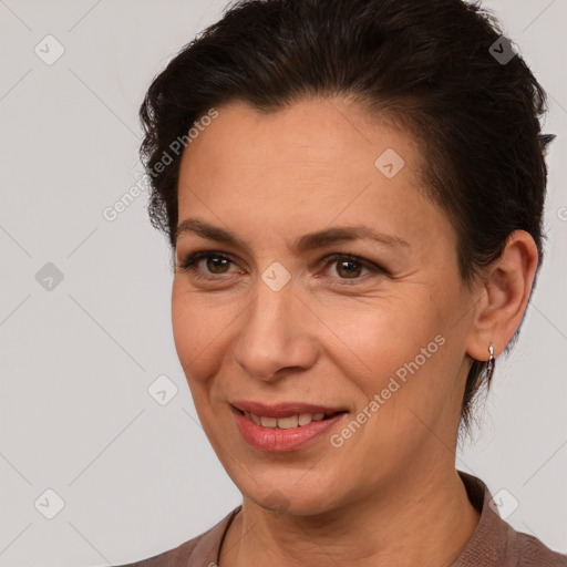 Joyful white adult female with short  brown hair and brown eyes