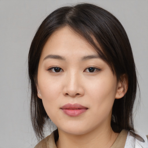 Neutral asian young-adult female with medium  brown hair and brown eyes