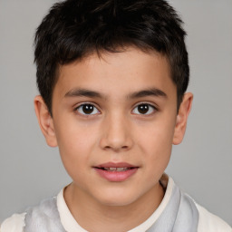 Joyful white child male with short  brown hair and brown eyes