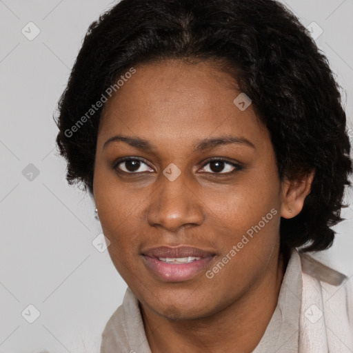 Joyful black adult female with short  brown hair and brown eyes