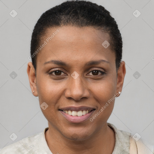 Joyful black young-adult female with short  black hair and brown eyes