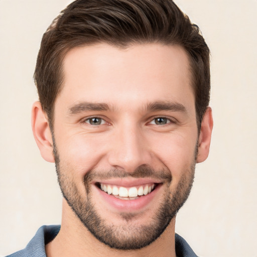 Joyful white young-adult male with short  brown hair and brown eyes