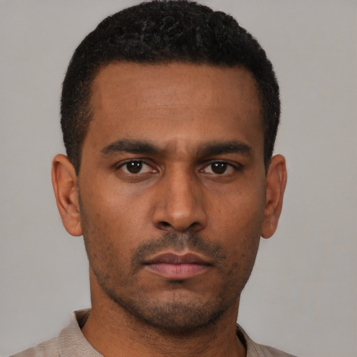 Neutral black young-adult male with short  black hair and brown eyes