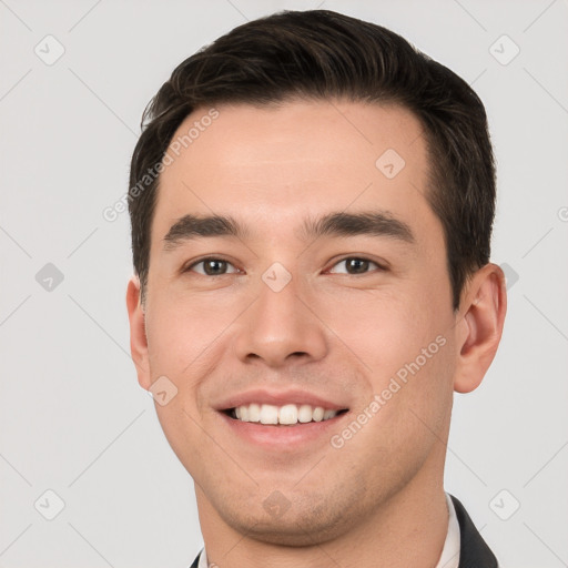 Joyful white young-adult male with short  brown hair and brown eyes