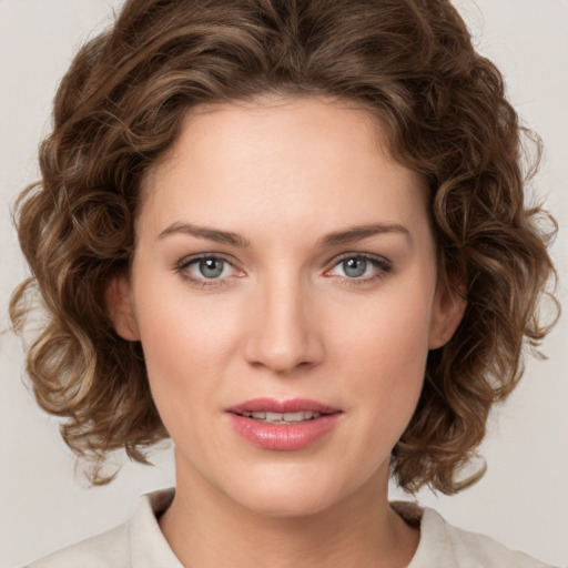 Joyful white young-adult female with medium  brown hair and green eyes