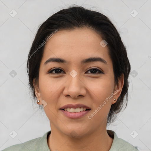 Joyful latino young-adult female with medium  black hair and brown eyes