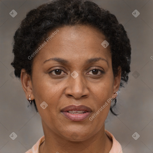 Joyful black adult female with short  brown hair and brown eyes