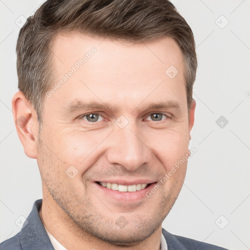 Joyful white adult male with short  brown hair and grey eyes