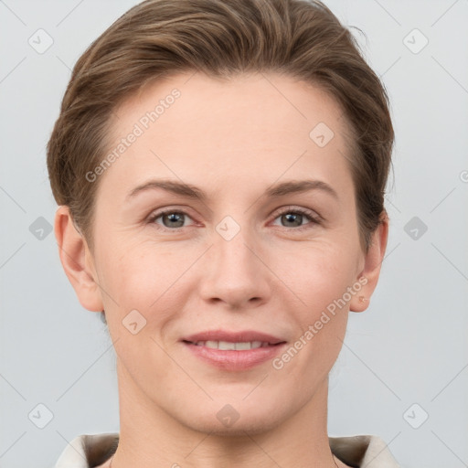 Joyful white young-adult female with short  brown hair and grey eyes