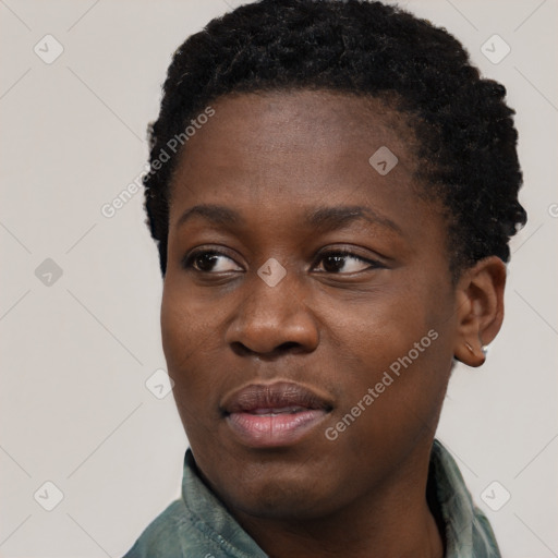 Joyful black young-adult female with short  black hair and brown eyes