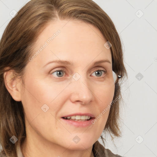 Joyful white adult female with medium  brown hair and grey eyes