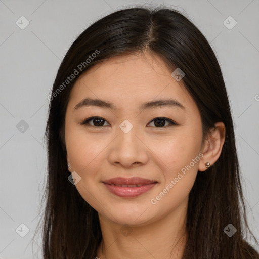 Joyful asian young-adult female with long  brown hair and brown eyes