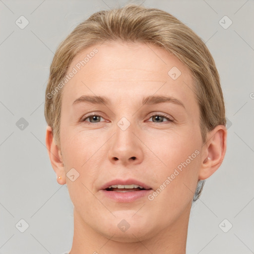 Joyful white young-adult female with short  brown hair and grey eyes