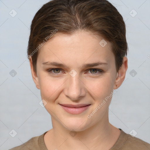 Joyful white young-adult female with short  brown hair and grey eyes