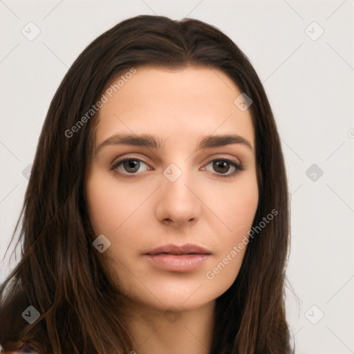 Neutral white young-adult female with long  brown hair and brown eyes