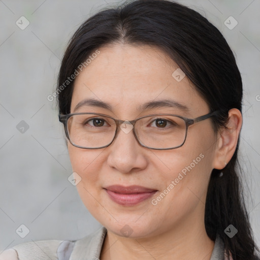 Joyful white adult female with medium  brown hair and brown eyes