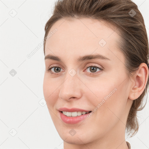 Joyful white young-adult female with medium  brown hair and blue eyes