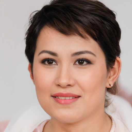 Joyful asian young-adult female with medium  brown hair and brown eyes