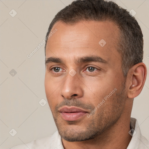 Neutral white young-adult male with short  brown hair and brown eyes