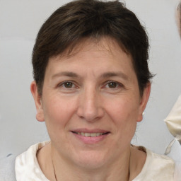 Joyful white adult female with short  brown hair and brown eyes