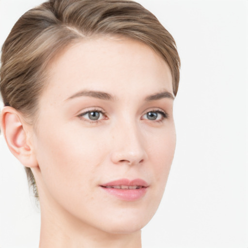 Joyful white young-adult female with short  brown hair and blue eyes