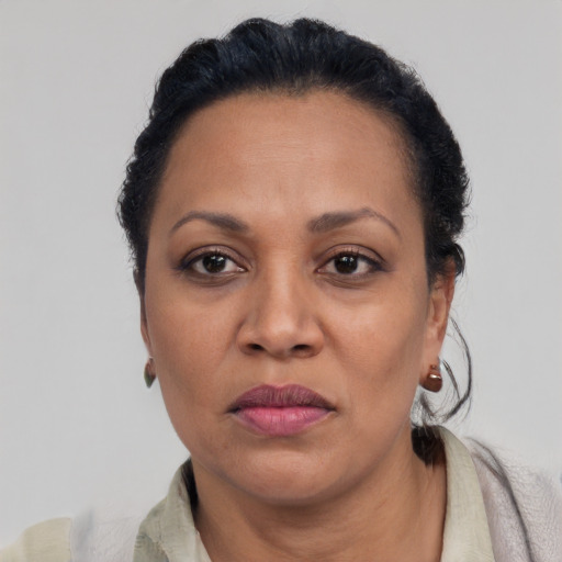 Neutral black adult female with medium  black hair and brown eyes