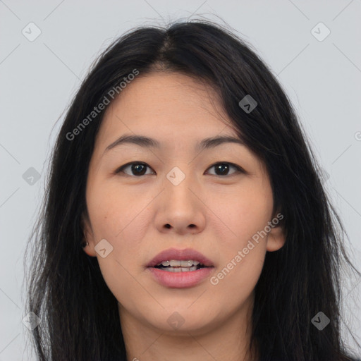 Joyful asian young-adult female with long  brown hair and brown eyes