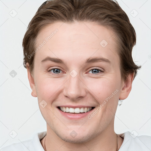 Joyful white young-adult female with short  brown hair and grey eyes