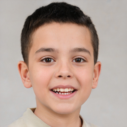 Joyful white child male with short  brown hair and brown eyes