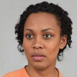 Neutral black young-adult female with medium  black hair and brown eyes