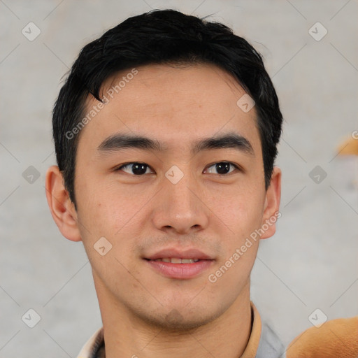 Joyful asian young-adult male with short  black hair and brown eyes