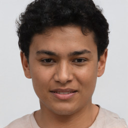 Joyful latino young-adult male with short  brown hair and brown eyes