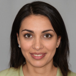 Joyful white young-adult female with medium  brown hair and brown eyes