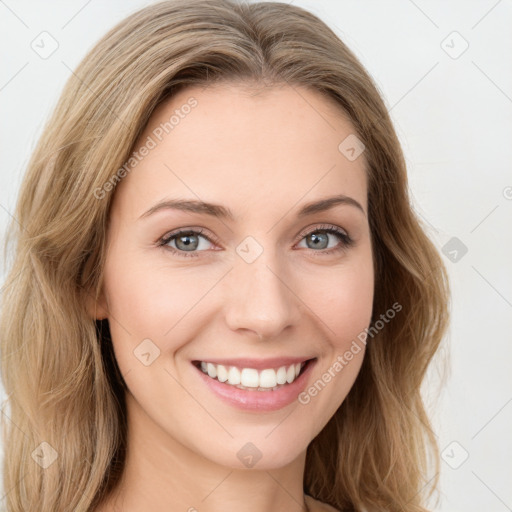 Joyful white young-adult female with long  brown hair and green eyes