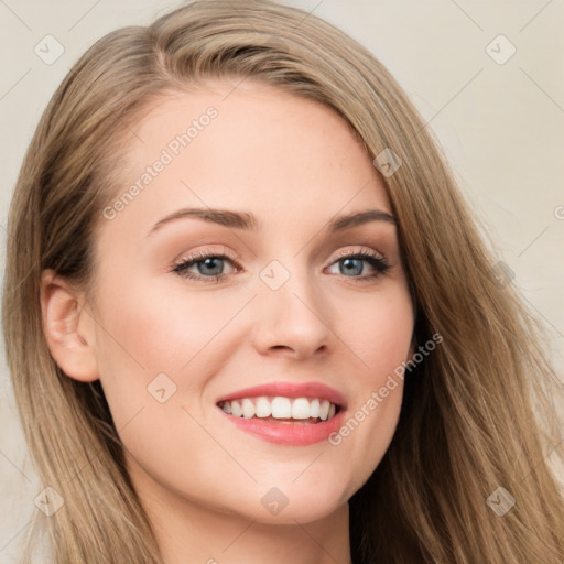 Joyful white young-adult female with long  brown hair and blue eyes